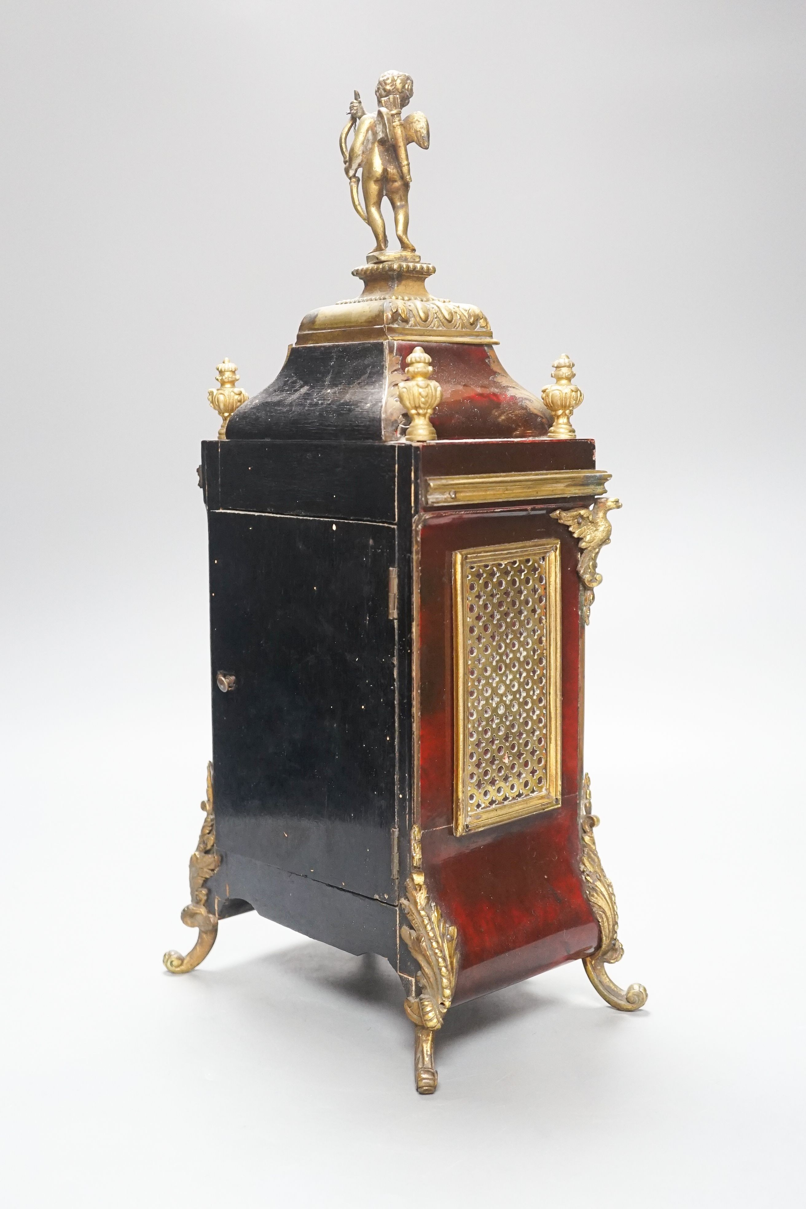 A 19th century French tortoiseshell and gilt metal mounted clock with key and pendulum 40cm